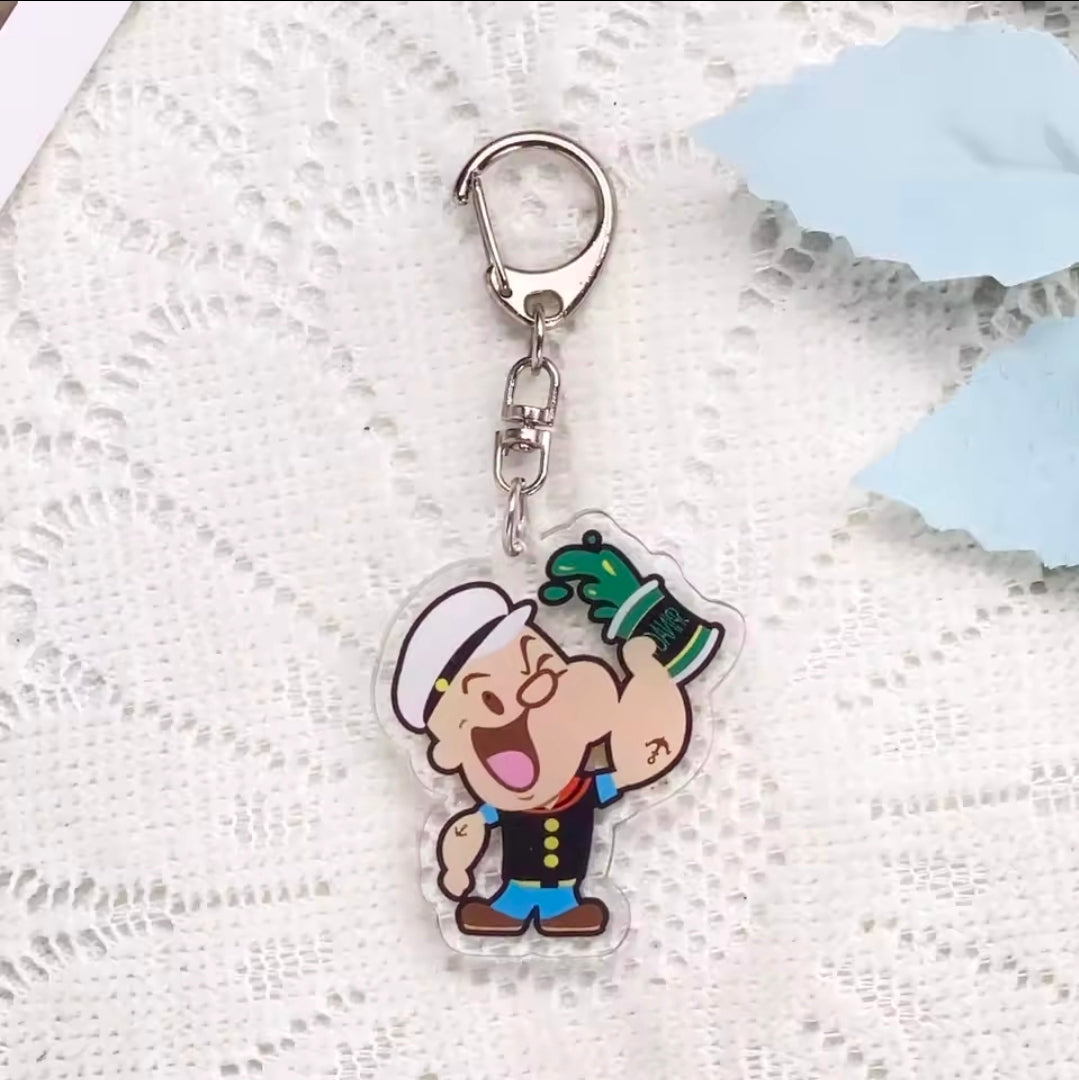 Acrylic keychain charm featuring Popeye and Olive Oyl hugging, cartoon couple