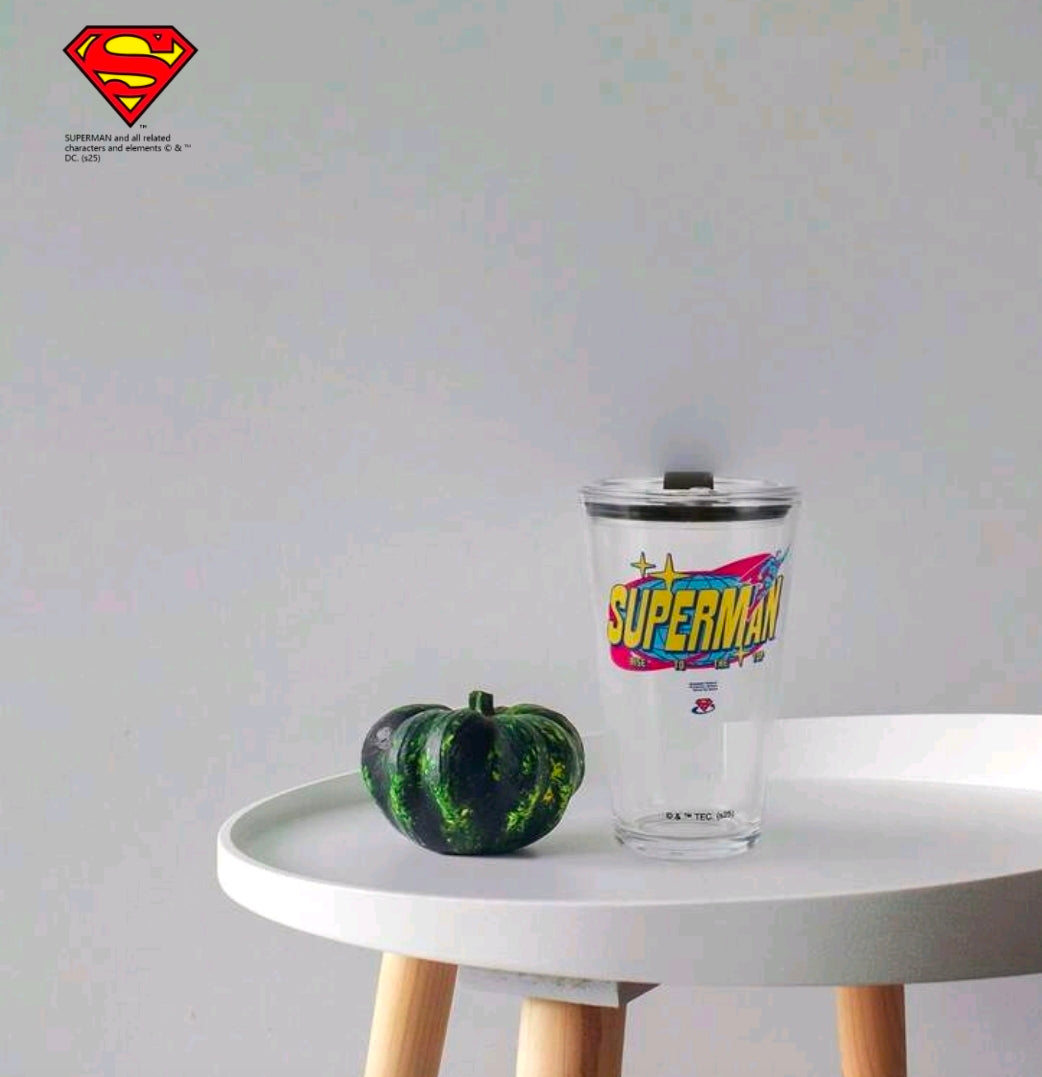 Clear Superman glass tumbler with black lid, small emblem near base
