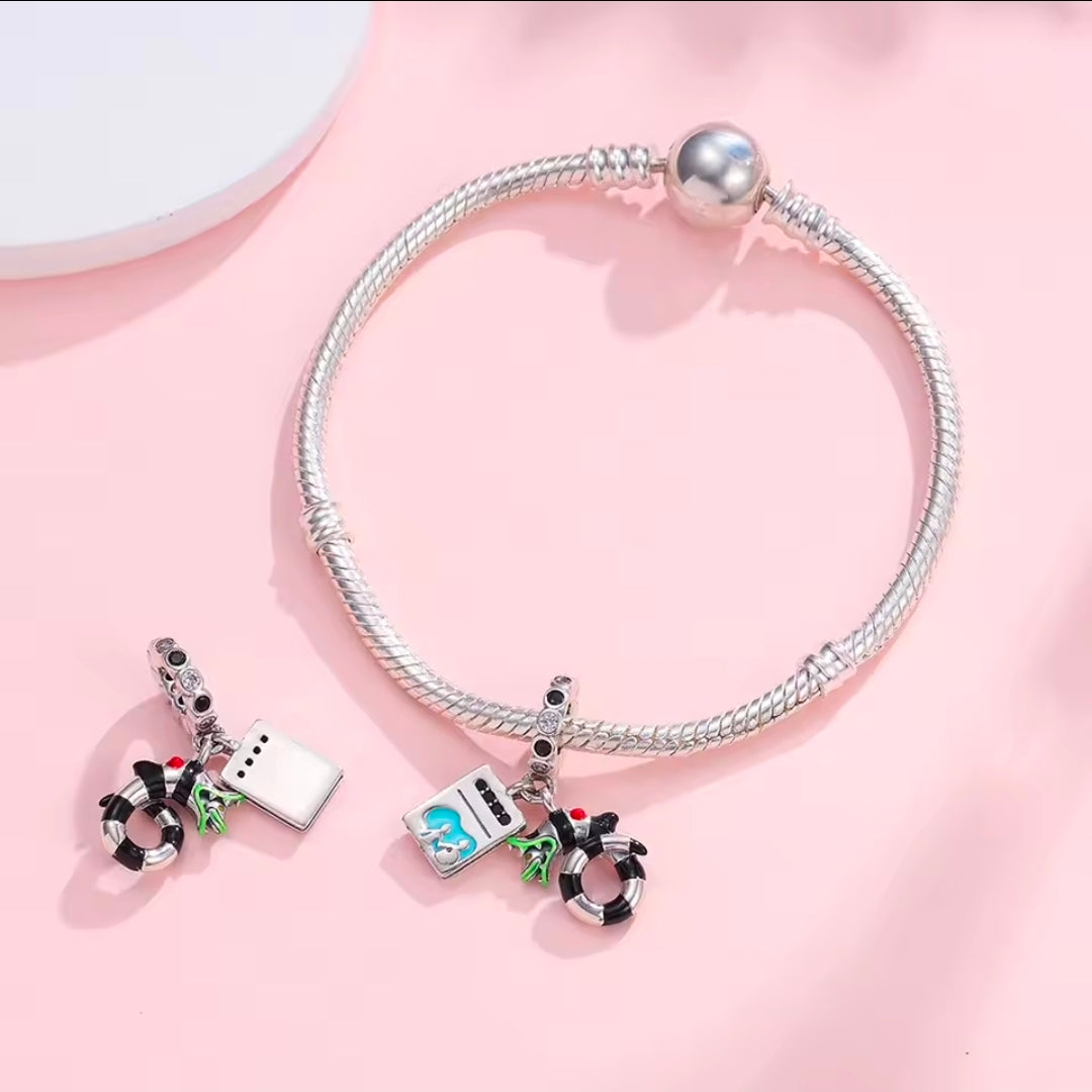 Silver charm bracelet with S925 dangle: teal square, black cauldron, hoop ring