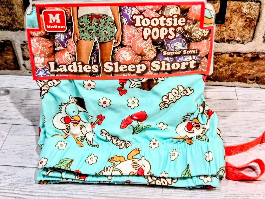 Mint pajama sleep shorts with cartoon character print and red ribbon detail