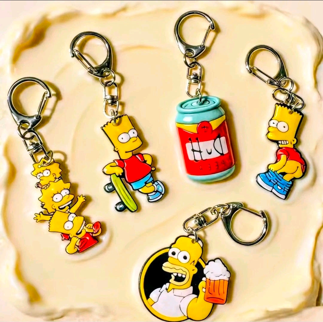 Simpsons acrylic keychain set with 5 character charms: Homer, Bart, and Duff beer can