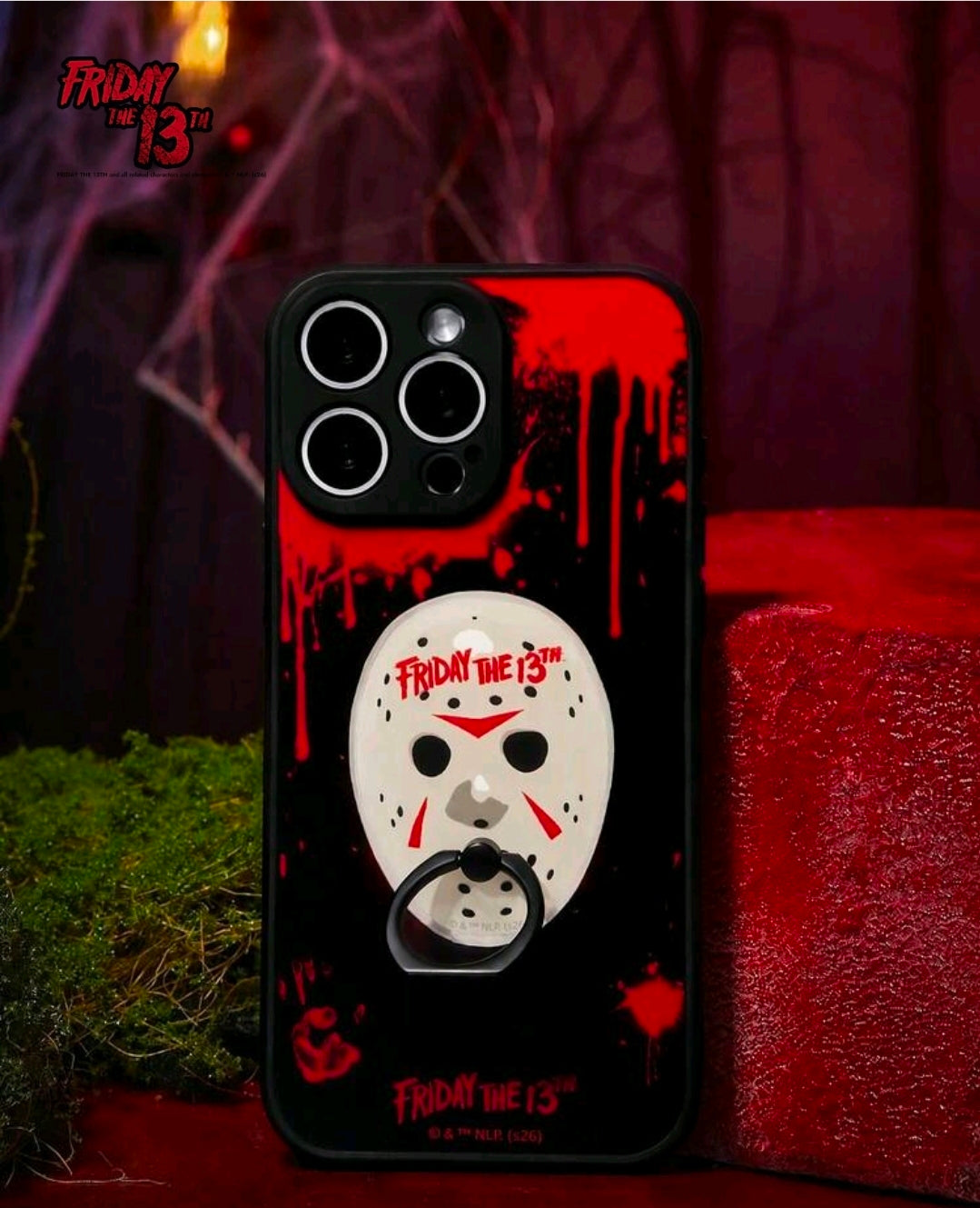 Friday the 13th phone grip attached to black phone case with red graphic