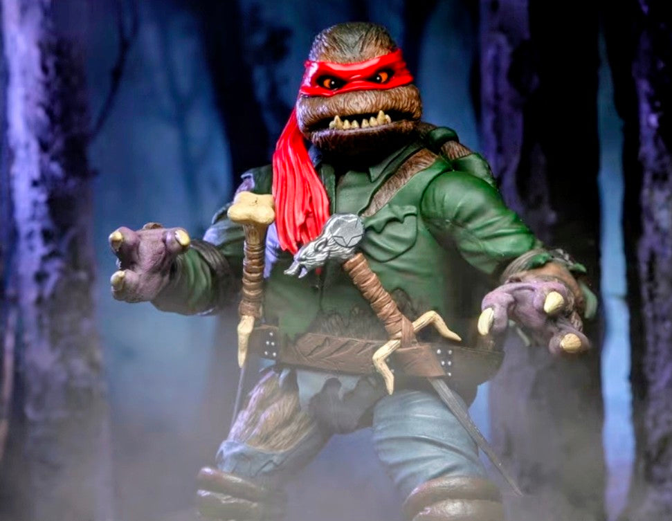 Raphael as Wolf Man action figure with cane, red hair, green vest, blue jeans, fists raised