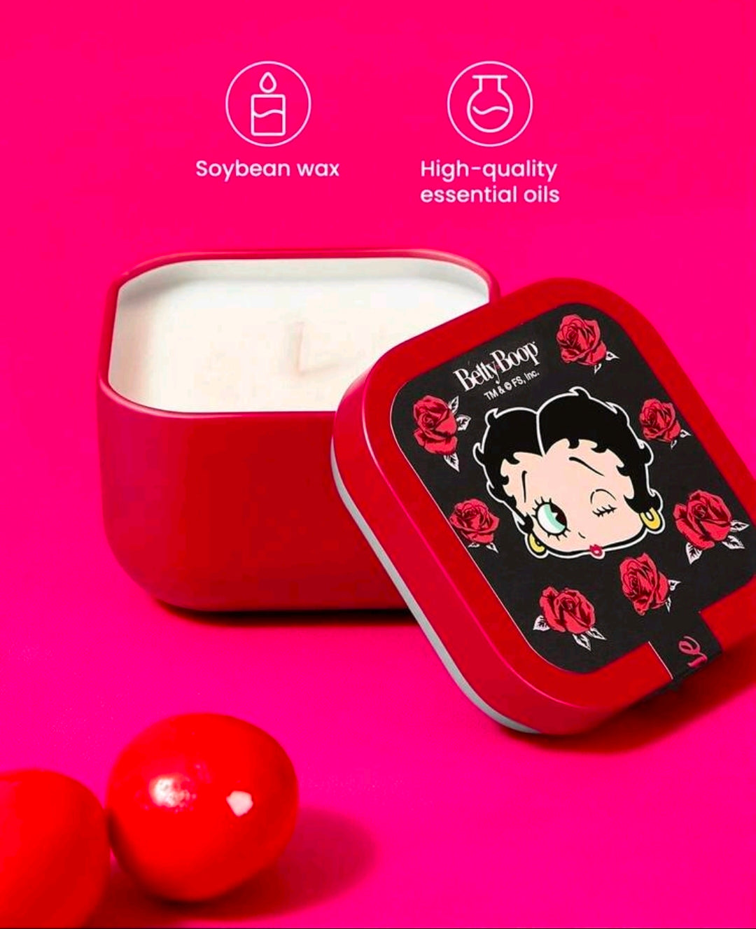 Red square candle tin with lid open; white wax visible inside