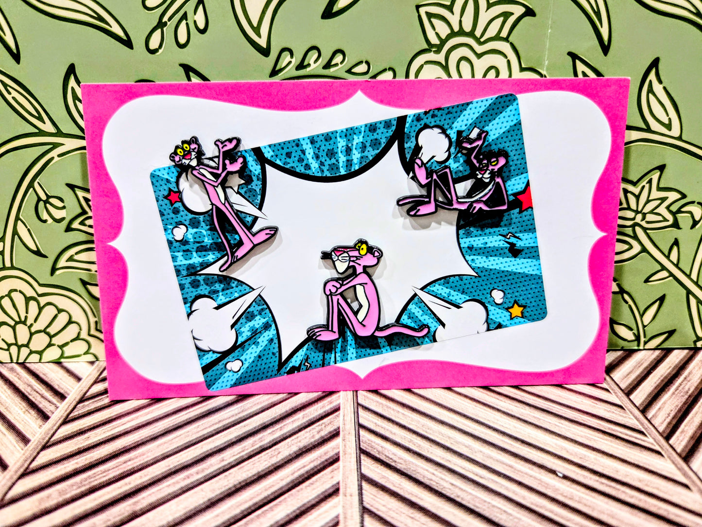 Enamel pin set: three pink-and-black cartoon cat pins in a window box