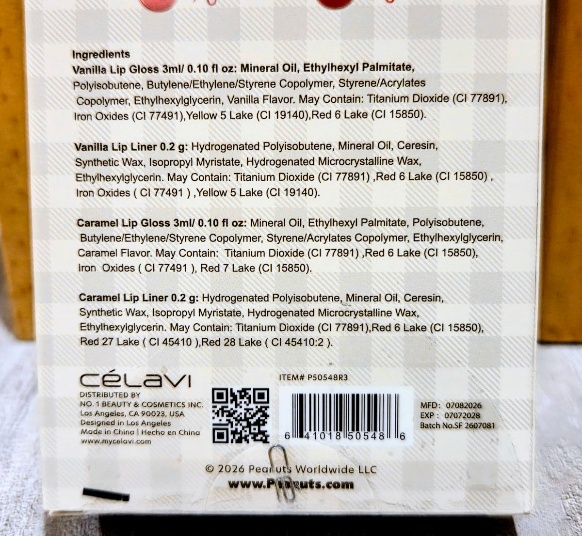 Lip kit packaging back panel showing ingredient list, barcode, and product code.