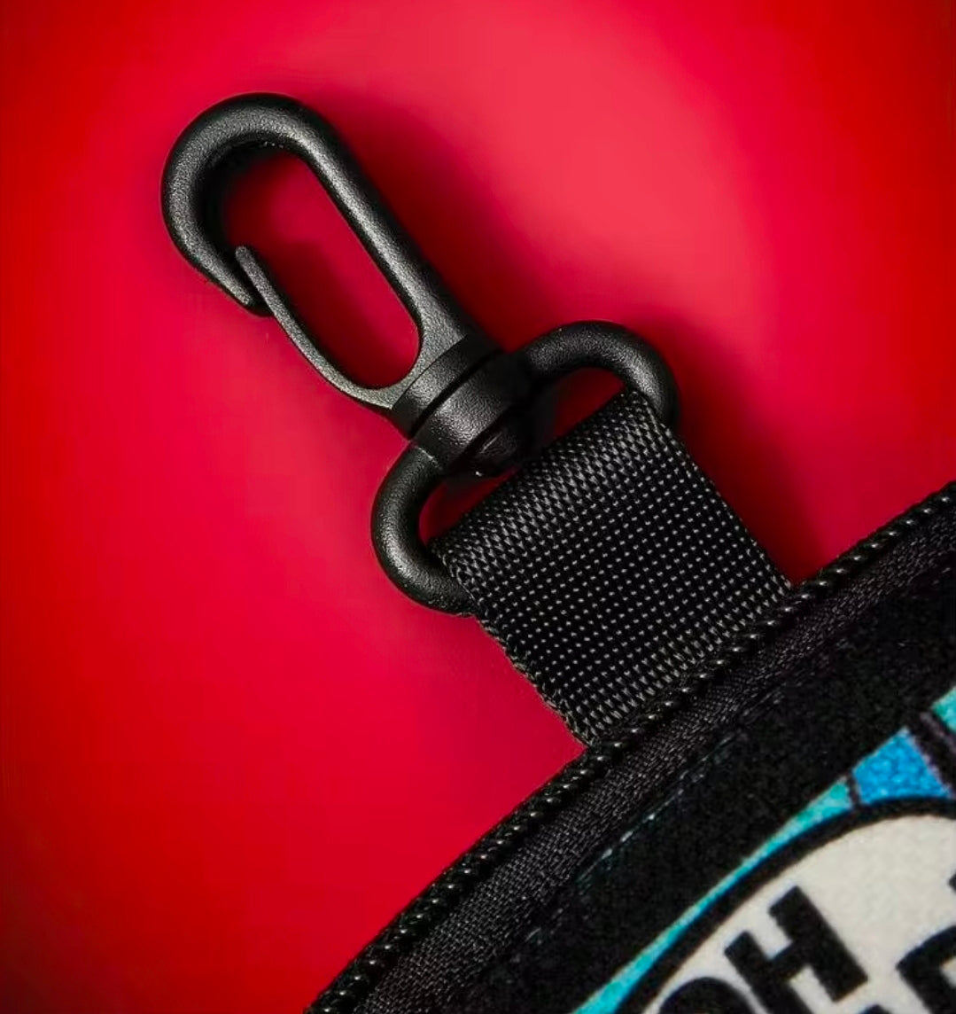 Black carabiner clip attached to Batman zip pouch strap