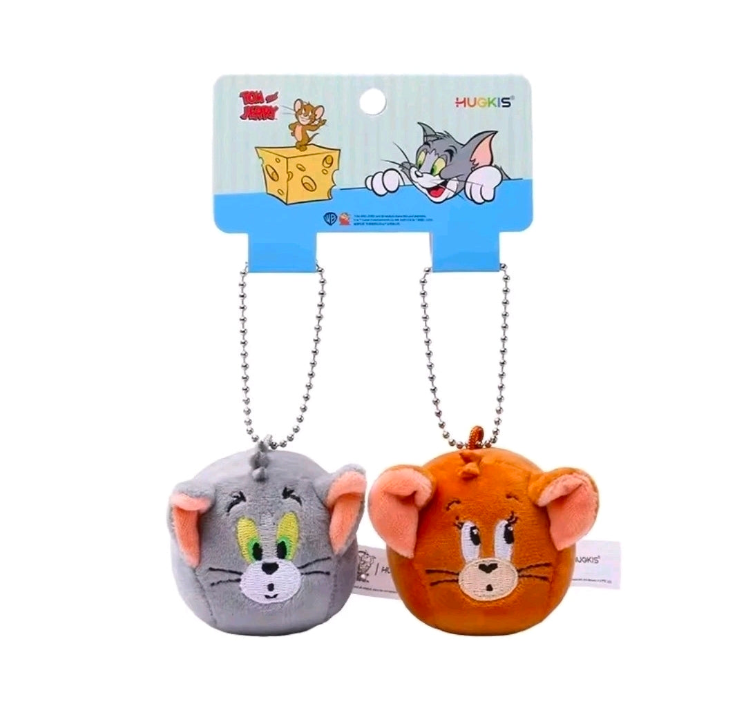 Mini plush keychain duo with hanging silver chains, gray and orange characters, tags visible
