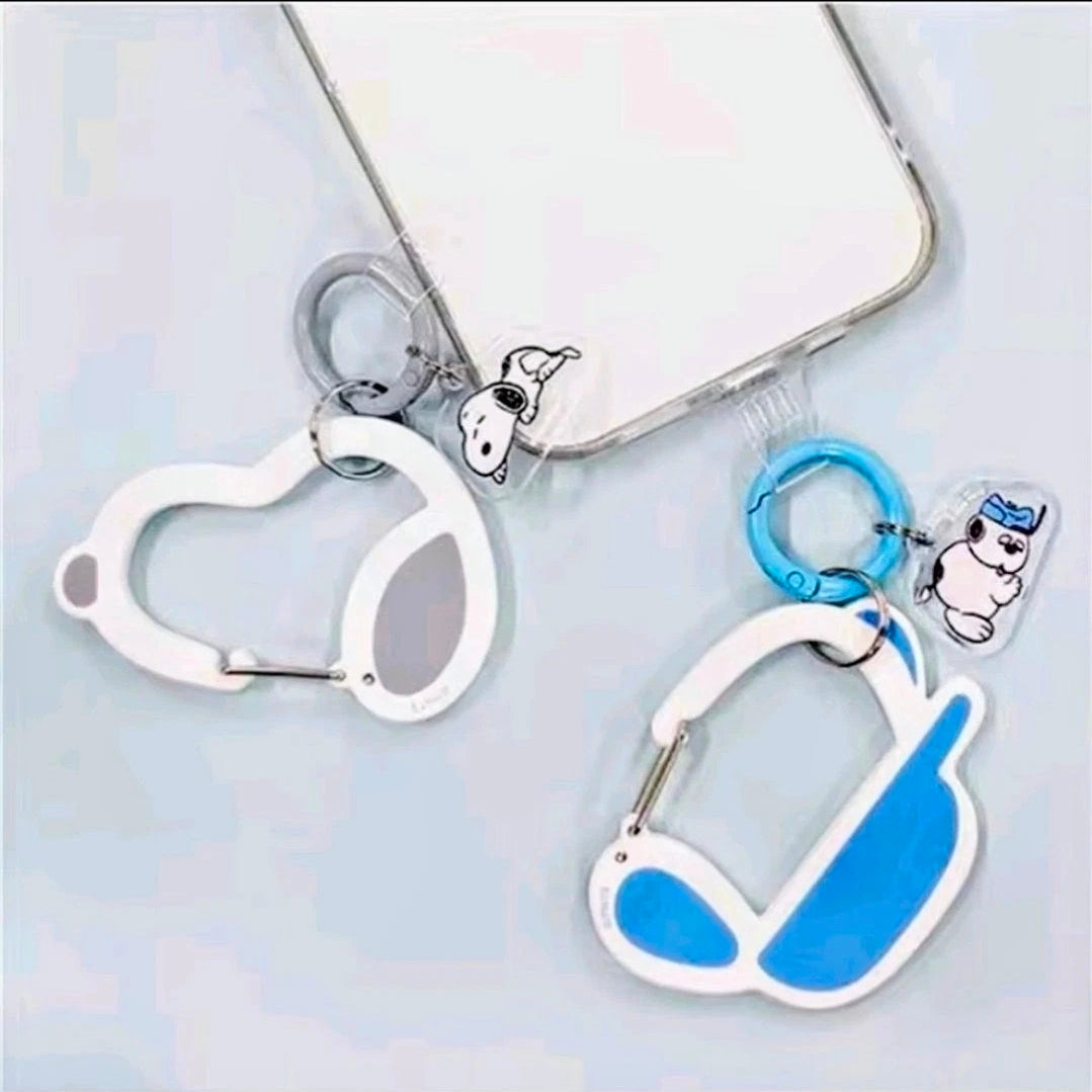Carabiner keychain set on phone case with Snoopy charm and blue rings