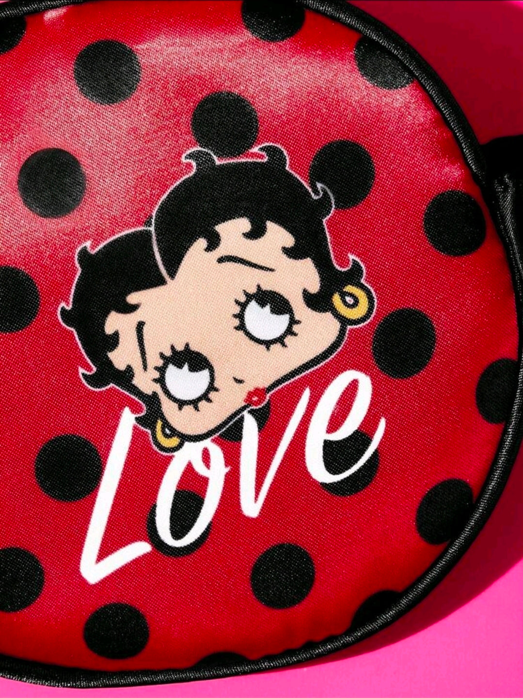 Red polka dot sleep eye mask with black trim and Love graphic