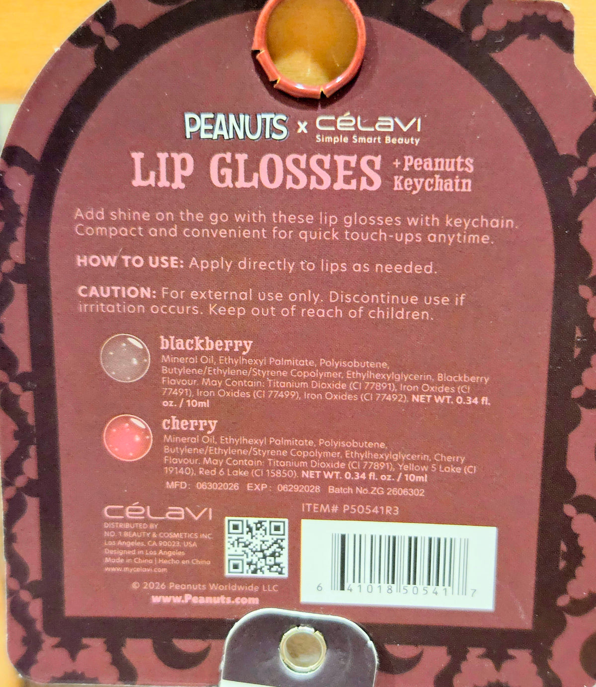 Halloween lip gloss set package with product label and Peanuts keychain