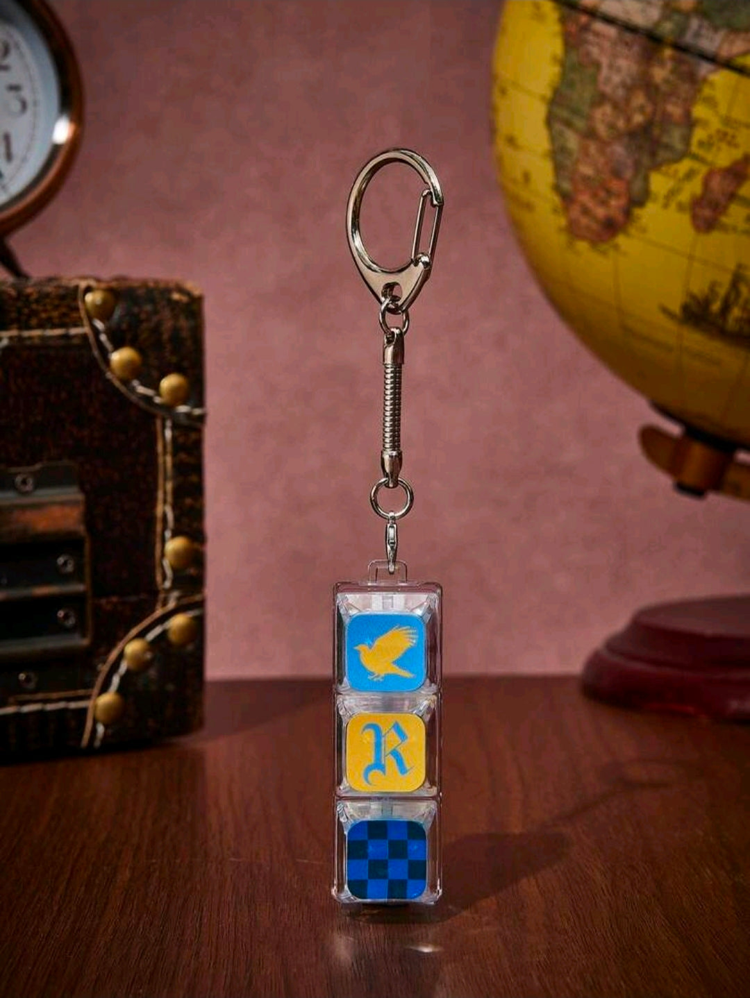 Ravenclaw keychain bag charm hanging with silver clasp and stacked clear blocks, bird and checkers