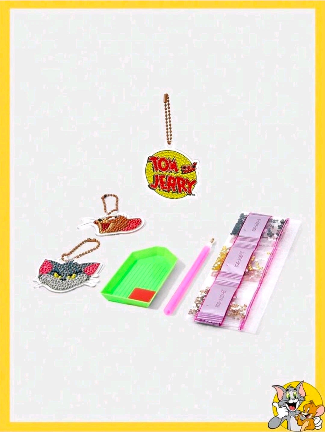 Diamond painting keychain kit accessories with charm shapes, bead loops, green tray and pink pen