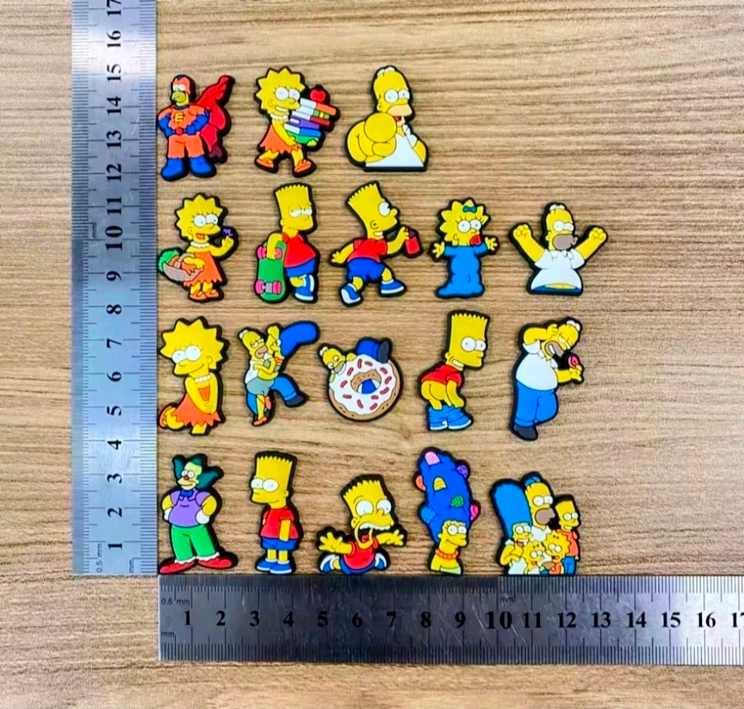 Simpsons shoe bag charms set shown with ruler, multiple character pins