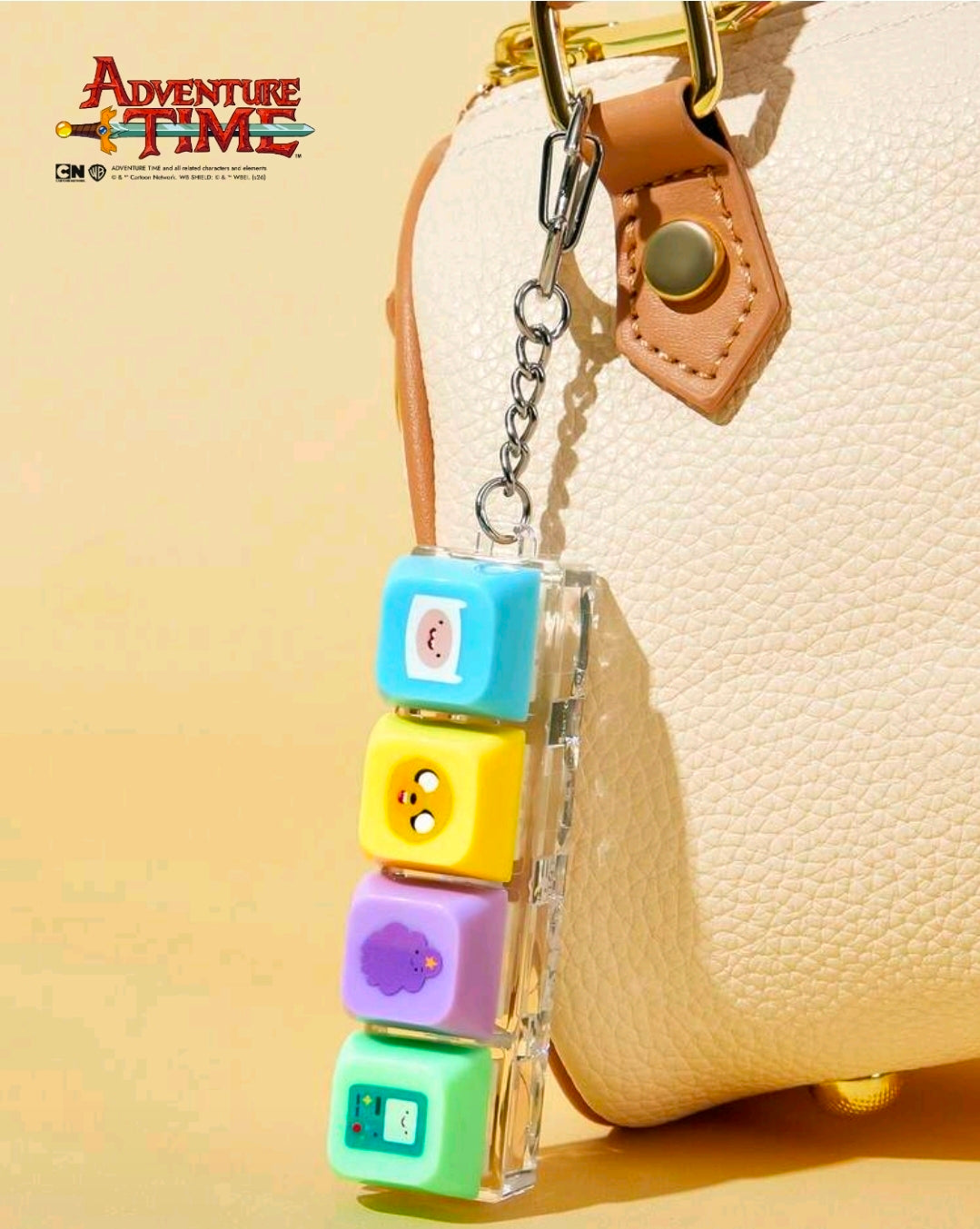 Adventure Time fidget keychain set with four cube clickers: blue, yellow, purple, green