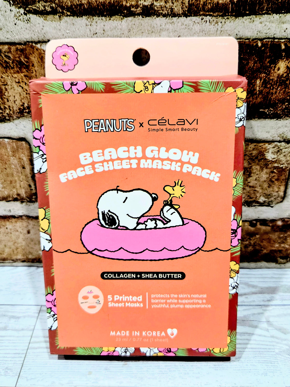 Beach glow face sheet mask pack, front with Snoopy on a purple cushion