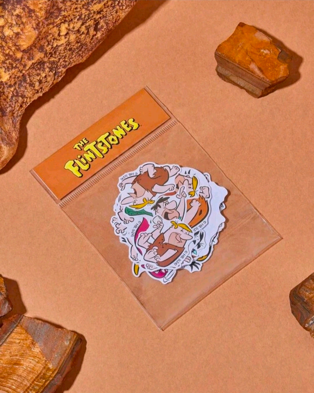 Sticker sheet with Flintstones characters: Fred, Wilma, Dino, and Barney