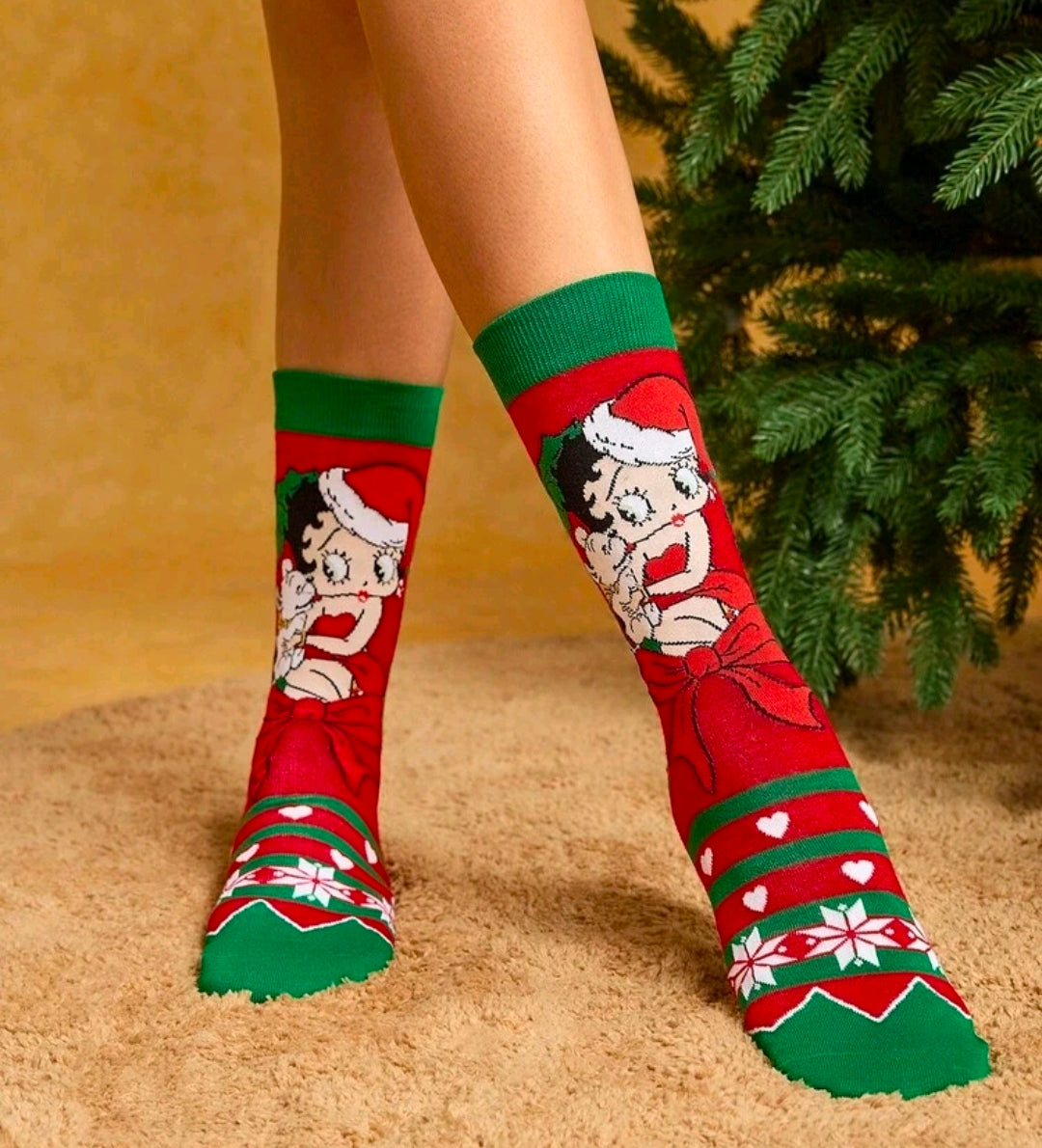 Holiday crew socks on legs, red and green with Santa face and striped cuff