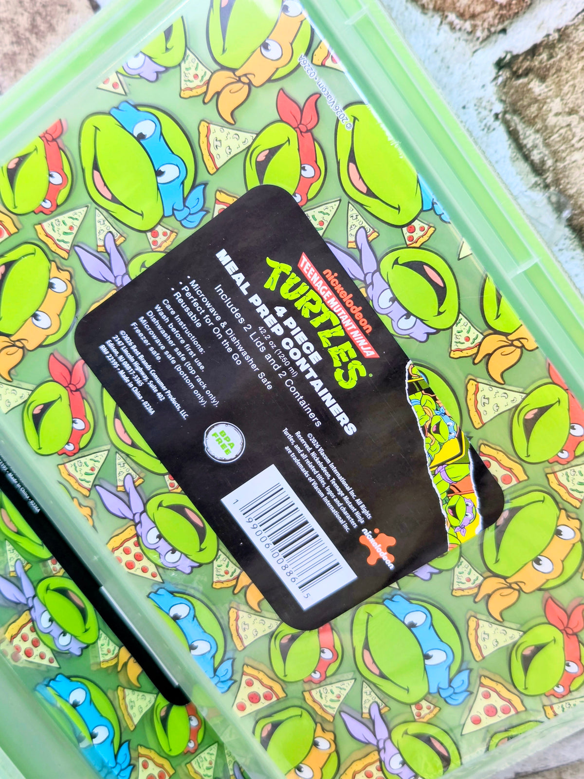 Clear meal prep container with black label and Teenage Mutant Ninja Turtles graphics