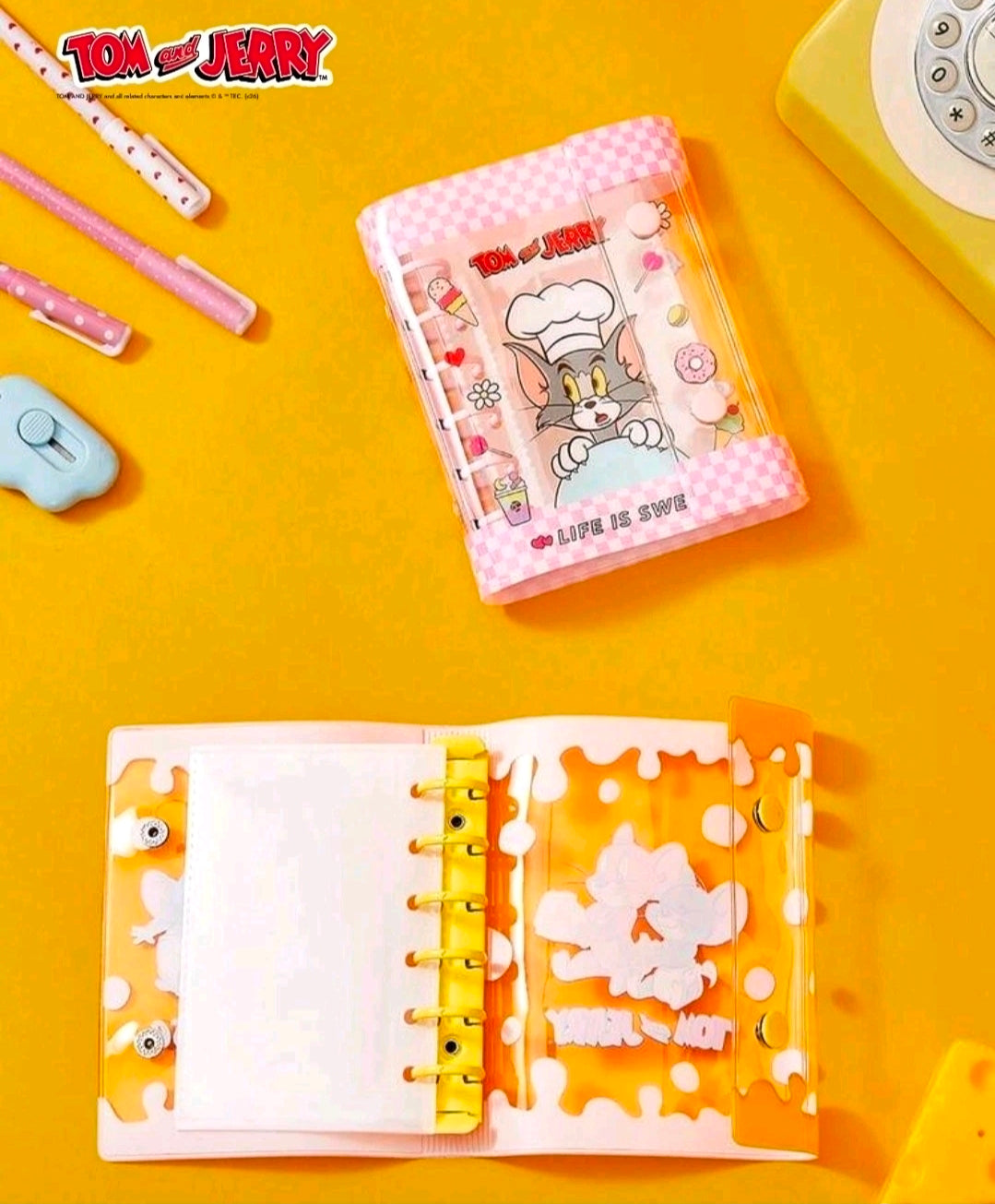 Open pink sticker binder planner with two pages and puzzle-style clear panels
