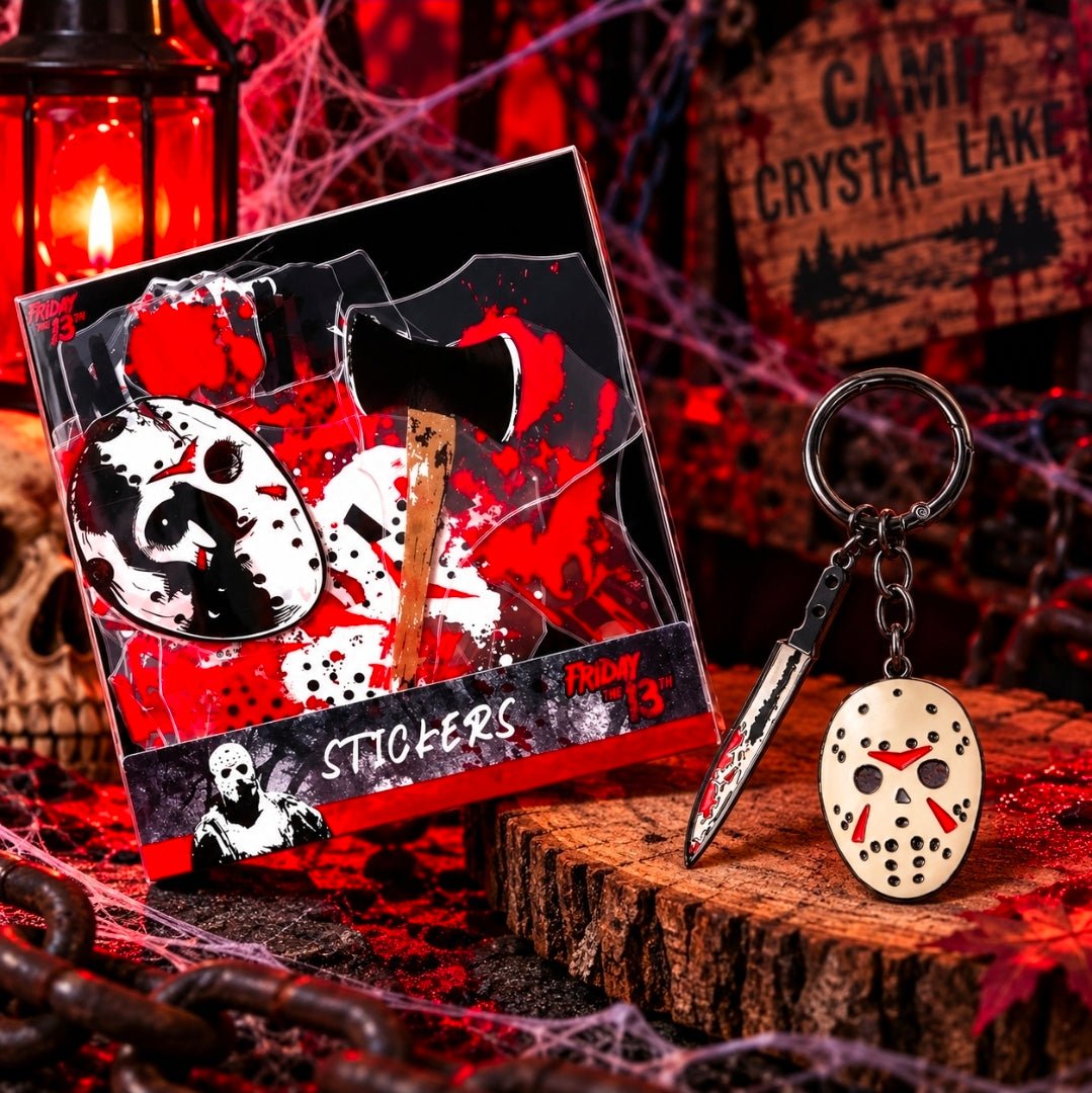 Sticker set and enamel mask keychain with red-and-black dagger charm in retail packaging