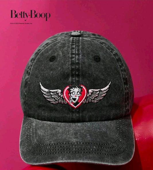 Black denim dad hat with embroidered wings and heart logo on the front