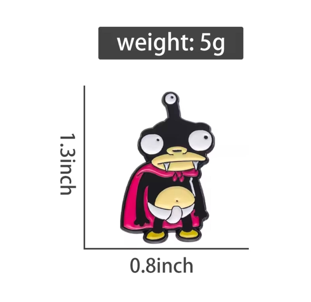 Nibbler character enamel pin in black and magenta with gold details and clasp