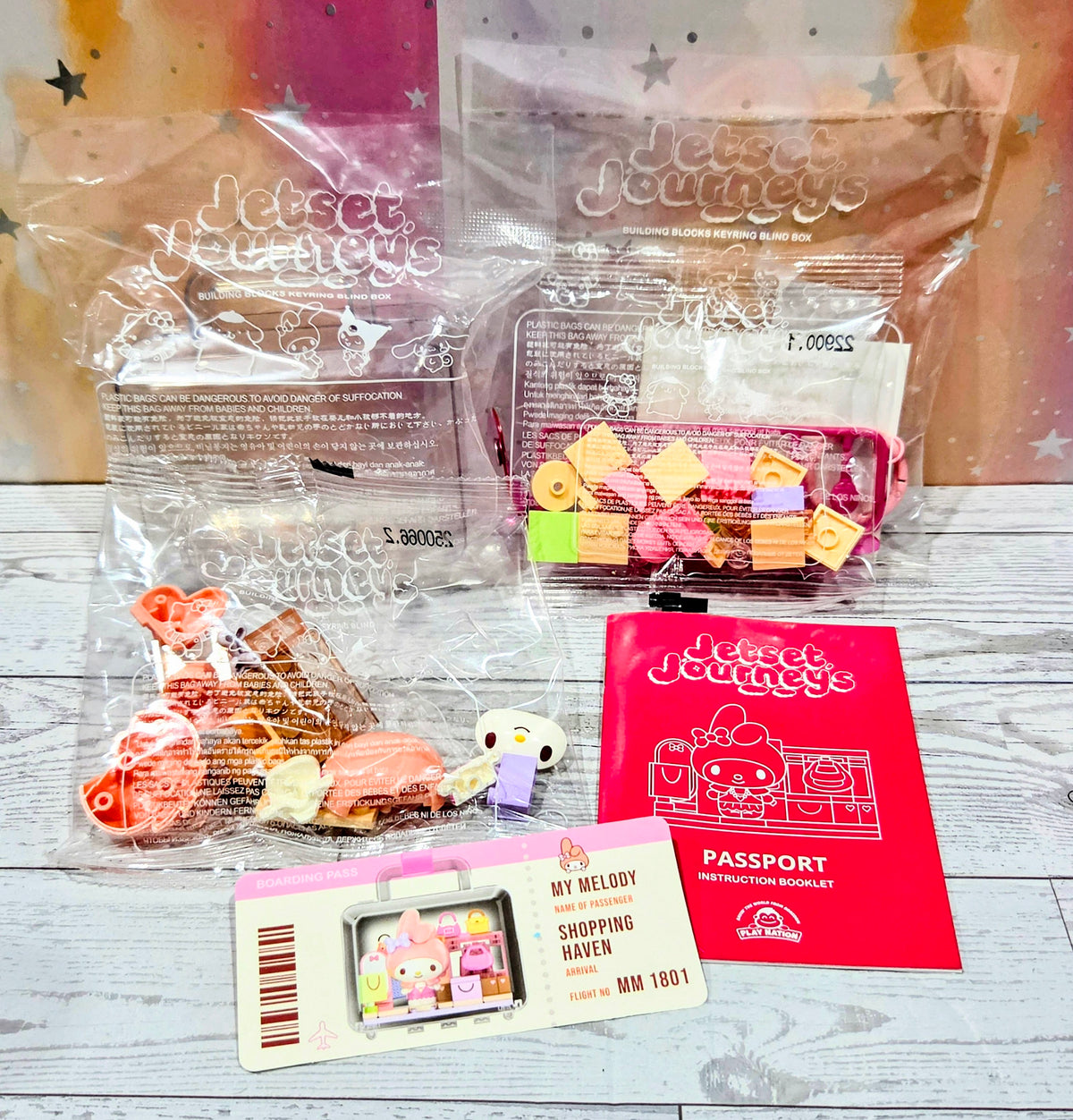 Jetset Journeys building block keychain set contents with passport booklet and parts
