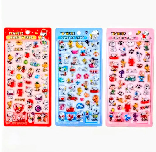 Set of three Peanuts Snoopy 3D acrylic charm sticker sheets: red, blue, pink