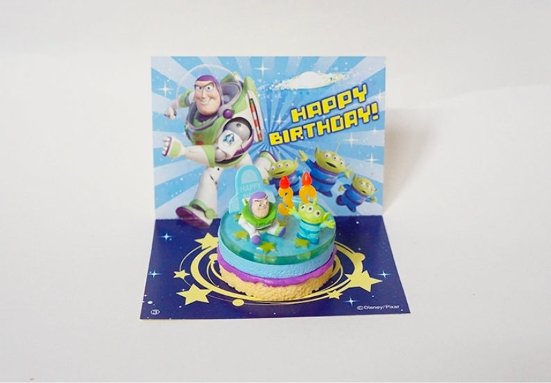 Mini cake figure in box packaging with space characters and birthday theme