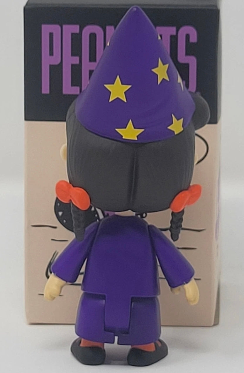 Halloween vinyl blind box figure with a purple wizard hat, purple outfit, and black shoes