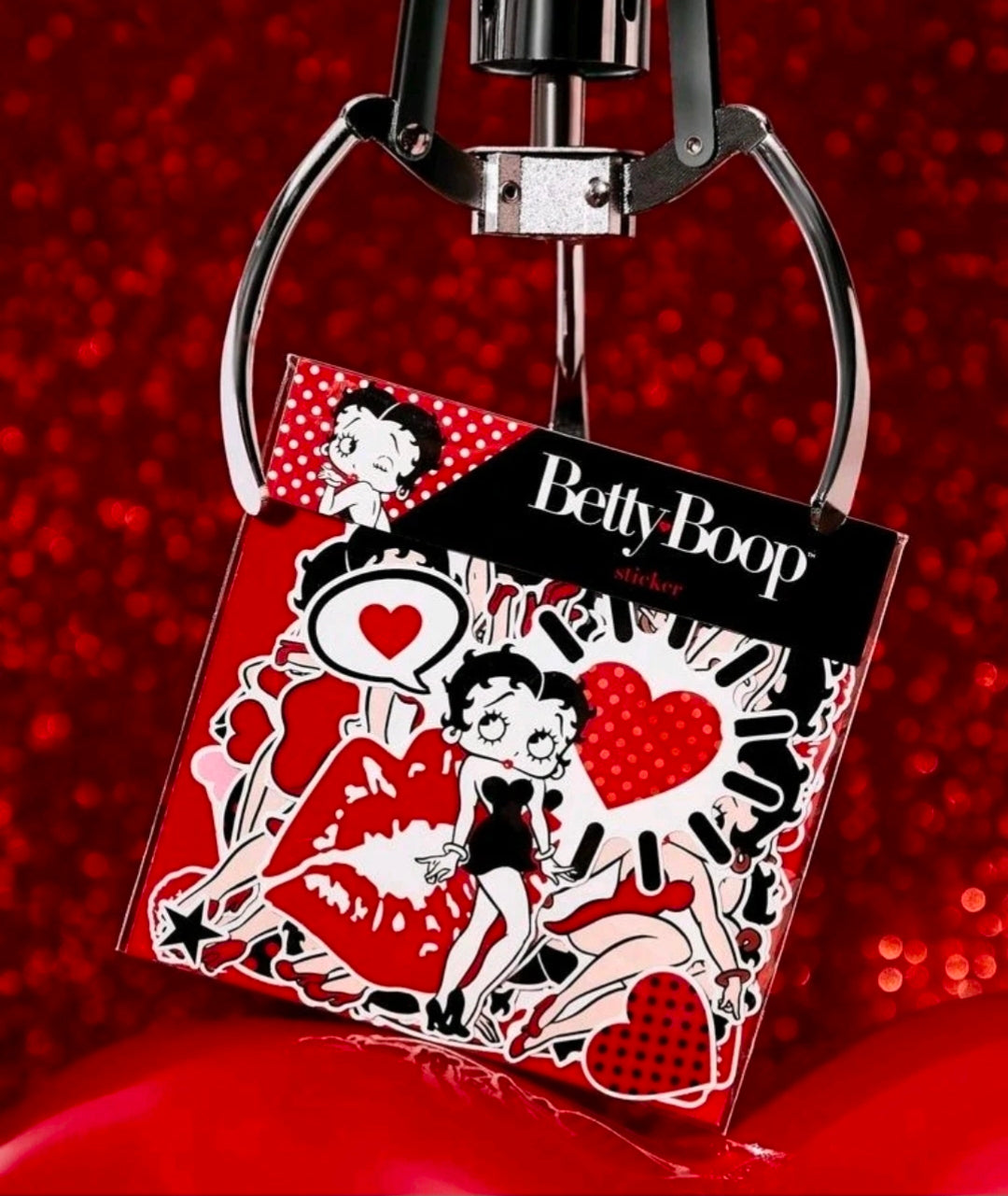 Betty Boop sticker pack shown in hand with red heart and polka-dot character decals