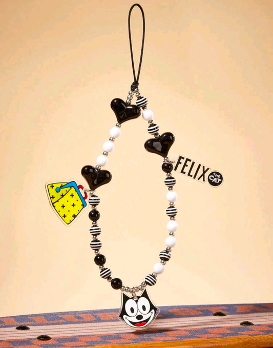 Black and white beaded phone charm lanyard with Felix face charm and striped bead accents