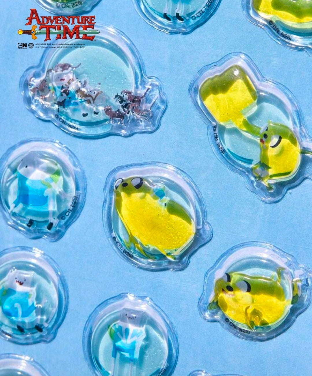 Clear 3D crystal bonbon stickers with yellow-green character shapes and domed surfaces