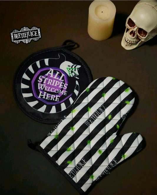 Oven mitt and round pot holder set with black-and-white stripes and green bug accents