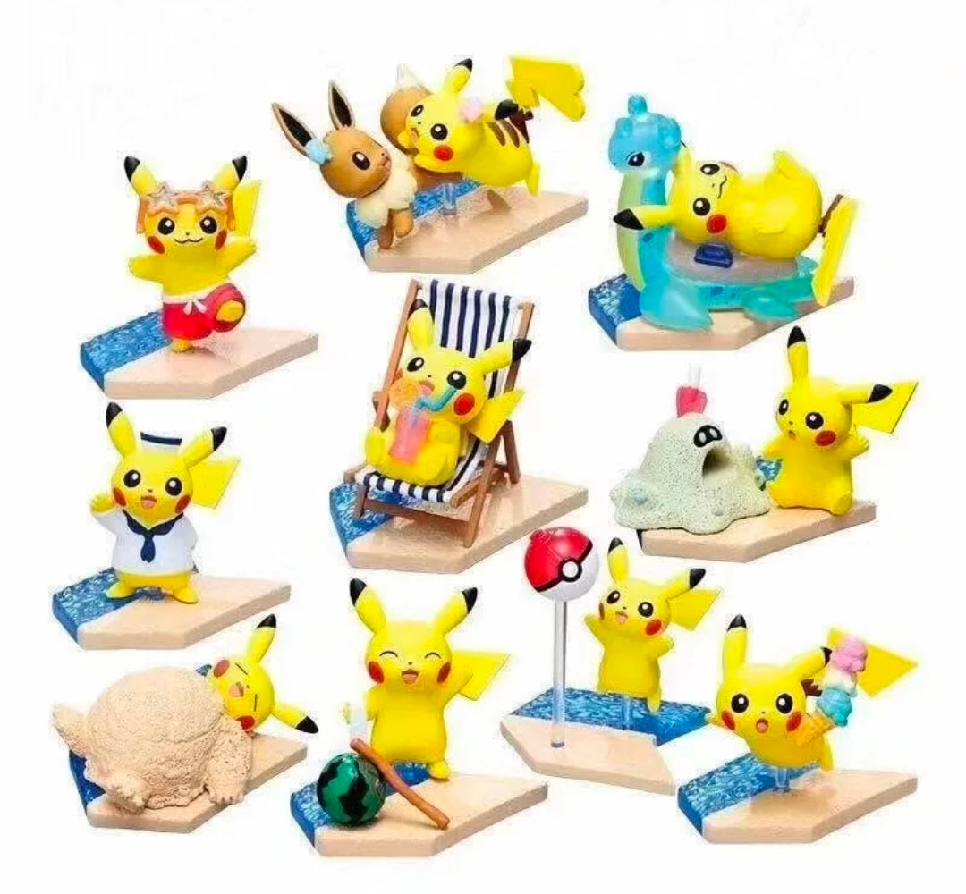 Assorted Pikachu seaside mini figures displayed on small sand bases with beach items