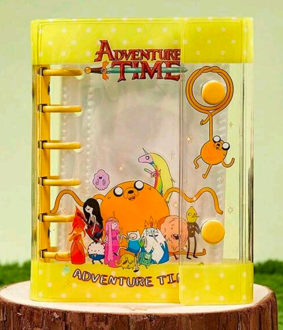 Yellow mini binder sticker album journal with Adventure Time character artwork and rings