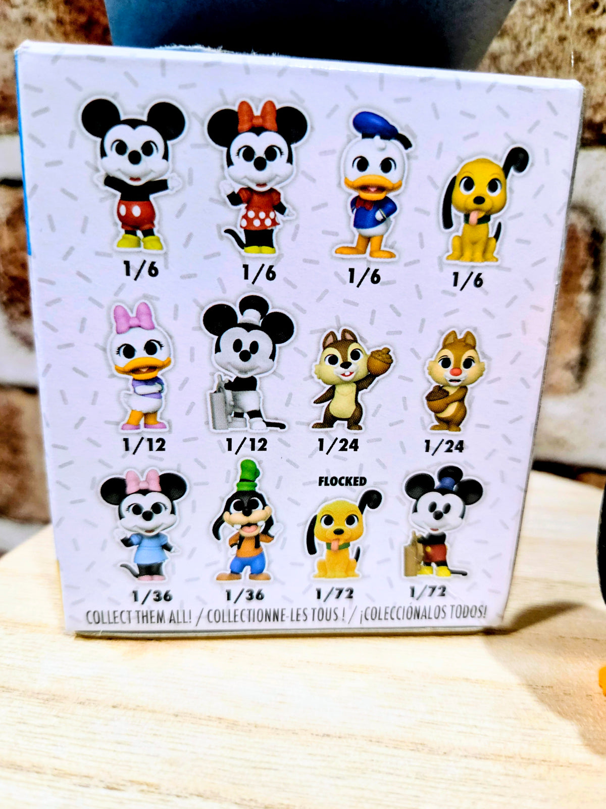 Mystery mini figure display box with Disney character lineup and chase labels