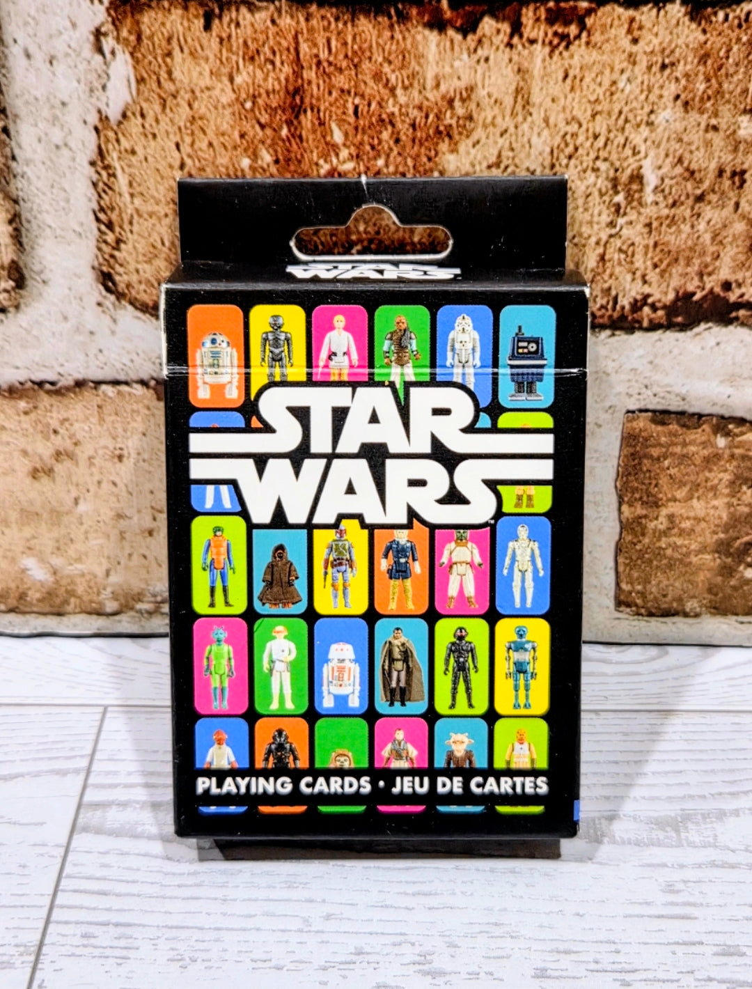 Star Wars playing cards deck with colorful character card lineup on retail box