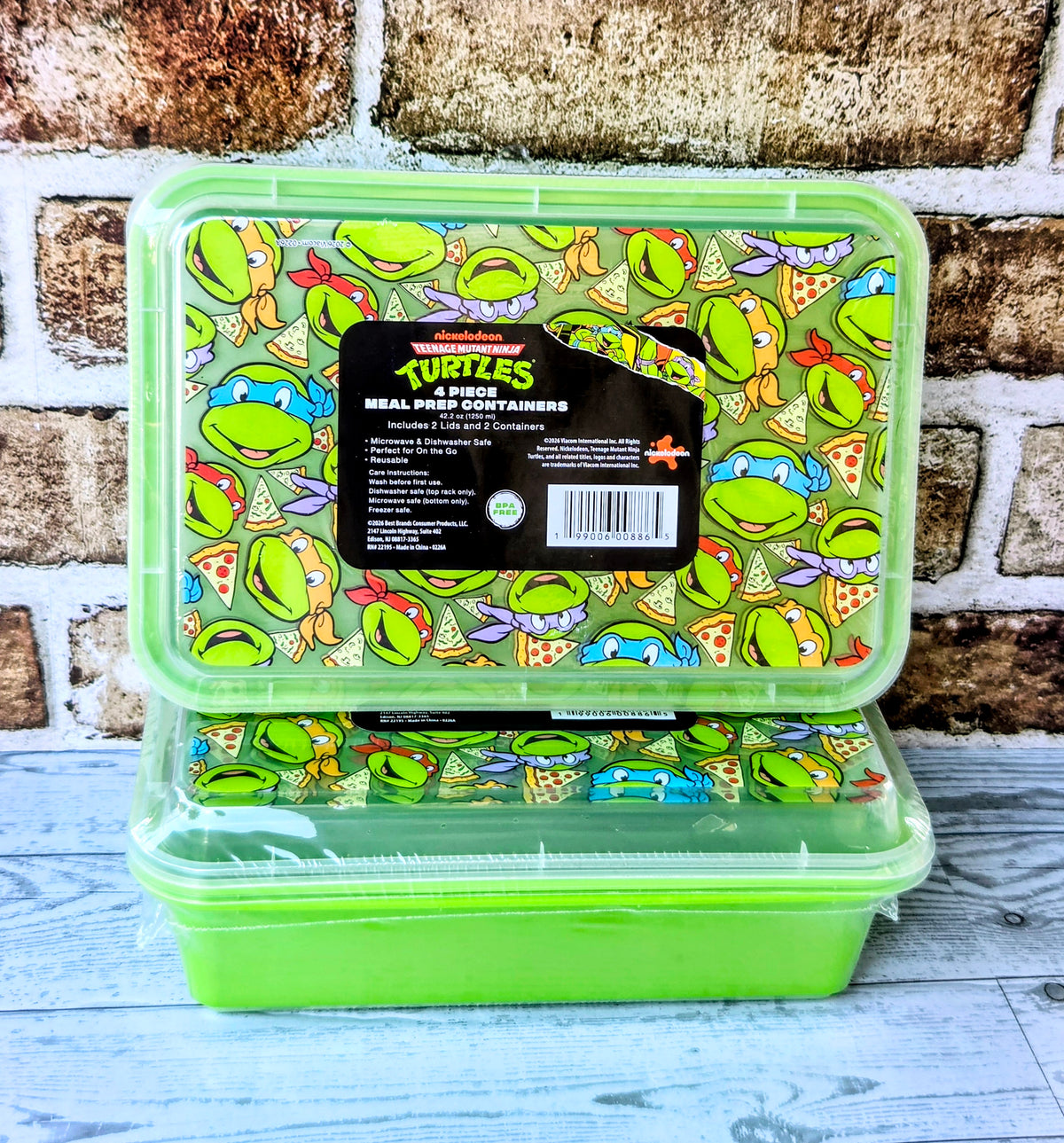 Open green meal prep container with Teenage Mutant Ninja Turtles cartoon pattern