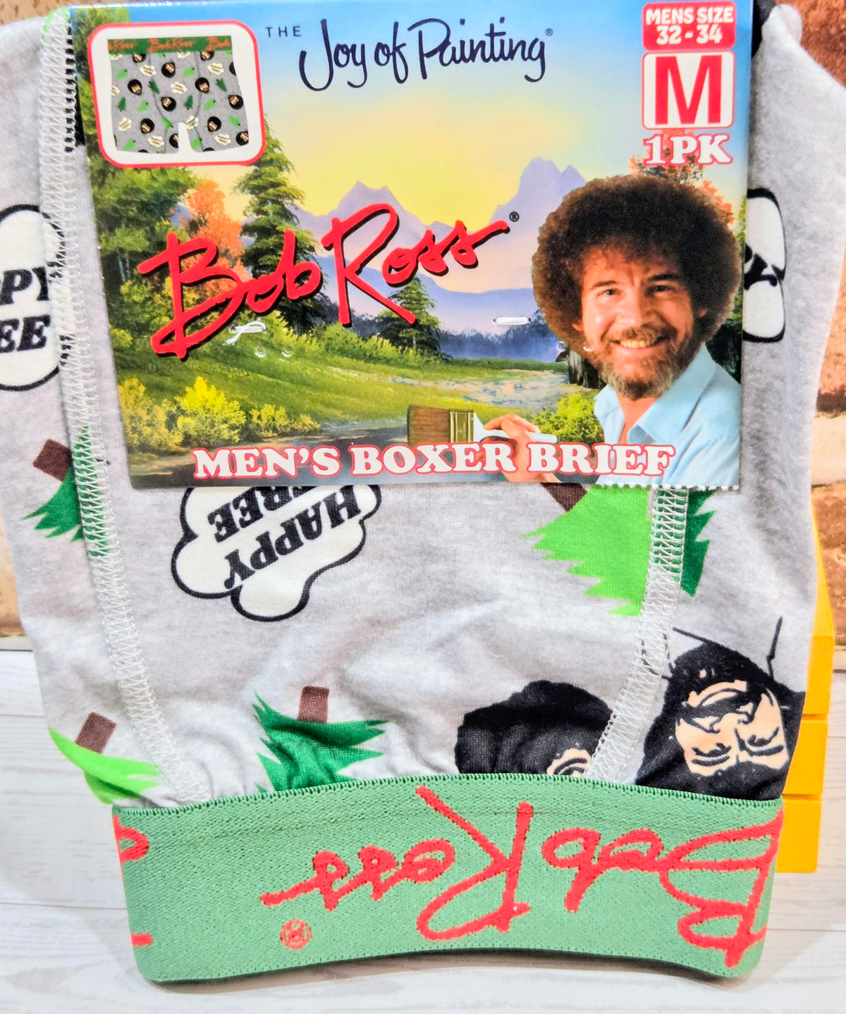 Men's boxer brief packaging: gray boxer briefs with landscape art, Bob Ross logo, M