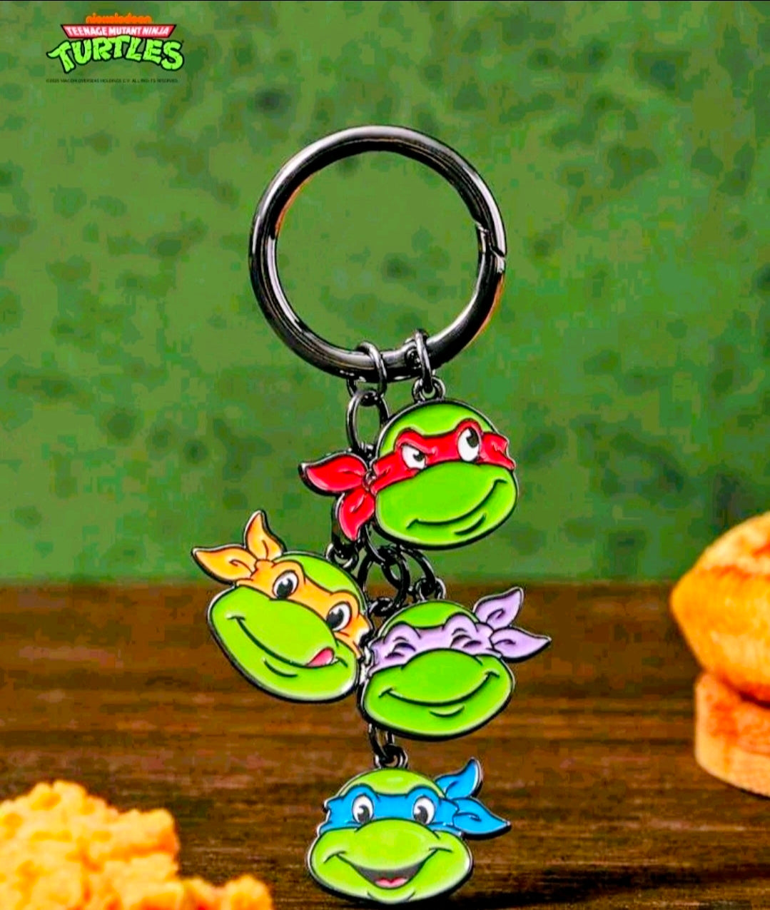 Teenage Mutant Ninja Turtles keychain with green turtle charms and metal split ring