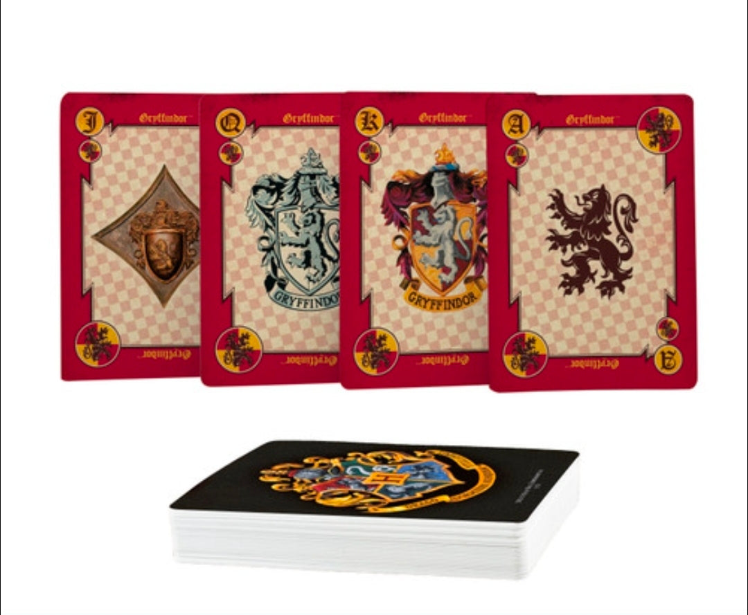 Hogwarts house playing cards with shield emblems; card stack shown