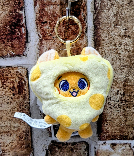 Yellow heart-shaped toast plush keychain with blue cartoon face and metal ring