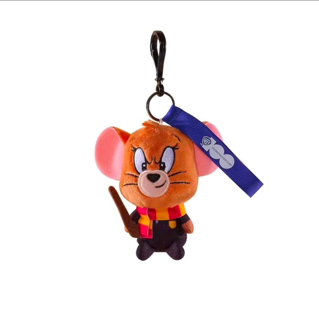 Orange wizard plush keychain with blue strap, black outfit, and wand on a metal loop