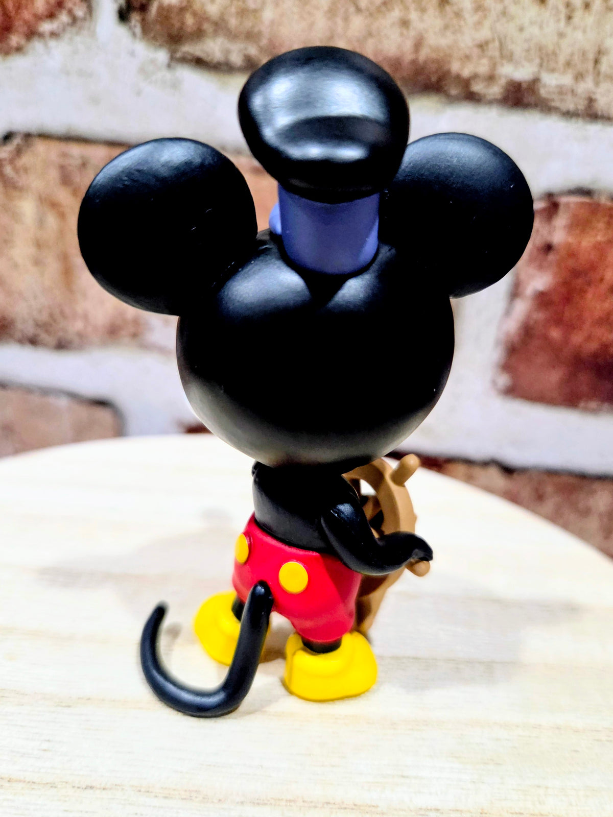 Mickey Mouse mini vinyl figure with arms out, red pants and yellow shoes