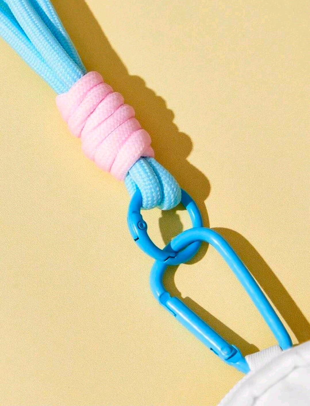 Blue lanyard with clasp attached to a mini zip coin purse