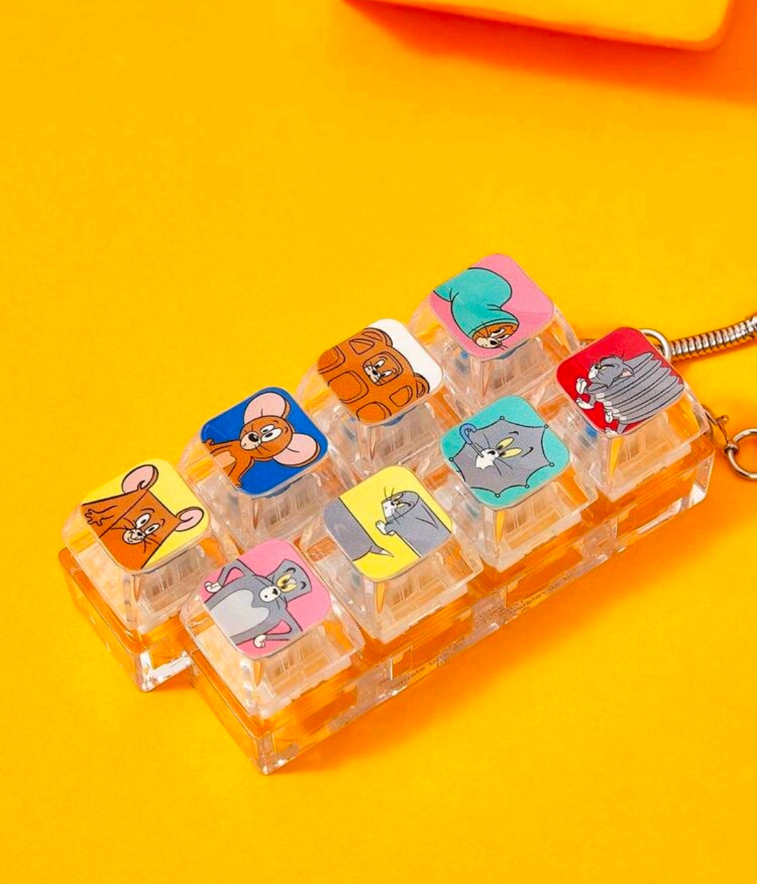 Cartoon keyboard fidget keychain with clear clicker buttons and character tile graphics