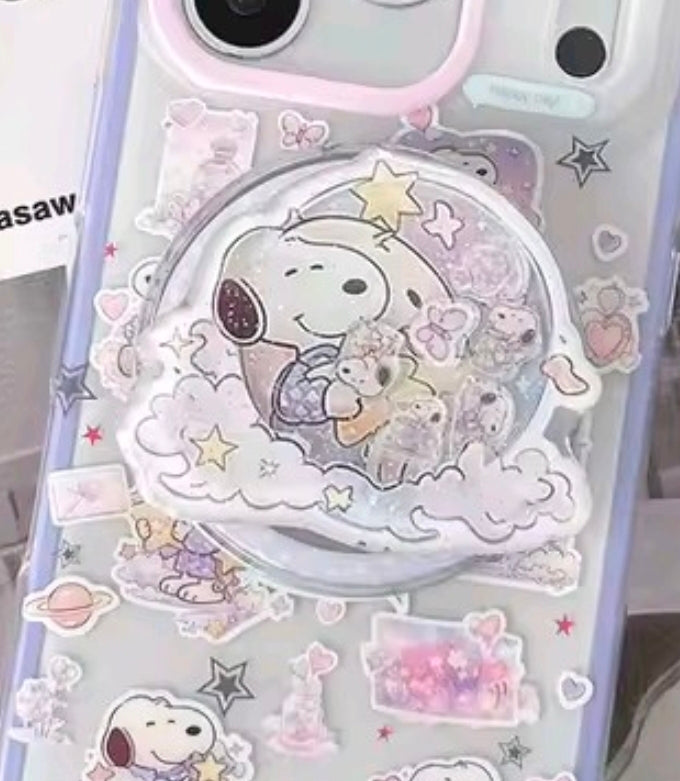 Round Snoopy acrylic glitter shaker phone grip with hearts, stars, and pastel clouds