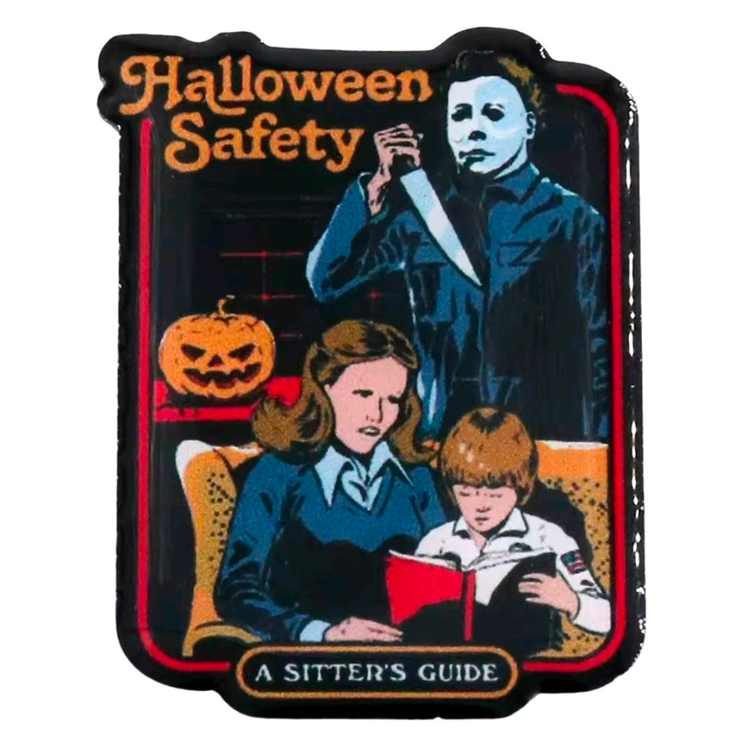 Close-up Halloween Safety enamel pin with Michael Myers, kids, and pumpkin artwork